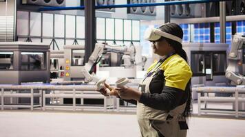 Photovoltaics smart factory expert using VR tech to manage automation systems. Solar panels industry 4.0 plant technician using virtual reality gear to evaluate equipment, camera A video