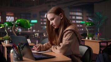 University student does research on foreign affairs via primary source materials and academic resources to create an assignment. Girl working hard for a scholarship and diploma. Camera B. video