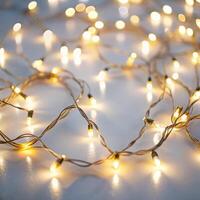 Delicate strands of glowing fairy lights forming a captivating design on a white backdrop, perfect for adding sparkle and magic to any celebration photo