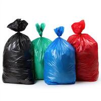 Four colorful garbage bags stand upright, isolated on white background photo