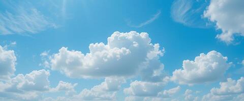 White Fluffy Clouds in a Bright Blue Sky A Serene View of Nature's Beauty photo