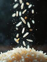 Rice grains falling into a pile photo
