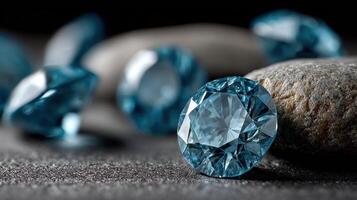 A striking contrast is created as a multitude of brilliant blue diamonds are displayed against a stark black background photo