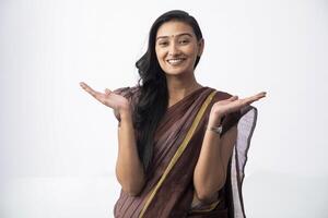 Stylish Model In Saree Showing Both Hands Open Palms While Looking At Camera photo