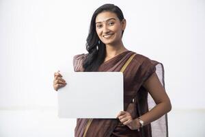 Model Posing With Whiteboard In Front Of Camera photo