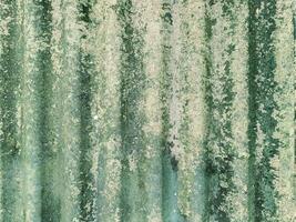 Close-Up of Corrugated Asbestos Surface with Visible Mold, Dirt, and Aging Patterns photo