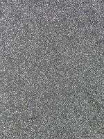 Close-up of asphalt texture showing gritty, realistic detail. Ideal for use in road designs, 3D modeling, architectural projects, and surface simulations for urban or outdoor settings photo