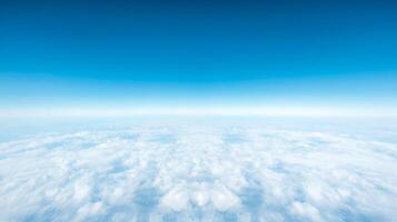 Blue Sky Over Soft White Cloudscape showing a serene and expansive aerial view with clear atmosphere and calm light from high altitude. photo