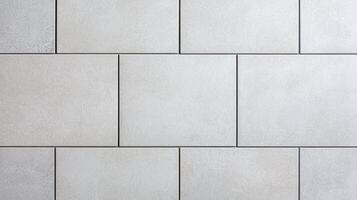 Light gray square ceramic tile wall texture featuring clean grout lines, subtle surface grain, and minimal geometric design ideal for flooring, walls, or architectural backgrounds. photo