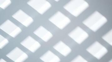 Abstract soft light grid shadow pattern with blurred square shapes creating a minimal and geometric visual effect on smooth surface. photo