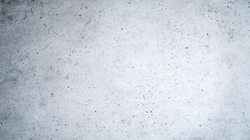 Light concrete wall with porous surface featuring tiny holes and a slightly speckled texture in a minimal gray finish. photo