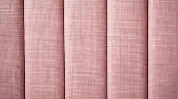 Close up view of pink upholstery fabric texture showing detailed textile weave and vertical pleats in soft lighting. photo