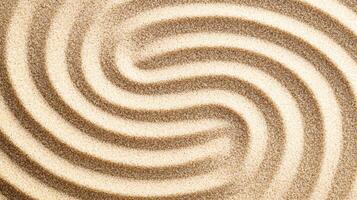 Abstract spiral pattern in fine sand texture with concentric curves and natural earthy tones forming a hypnotic design. photo