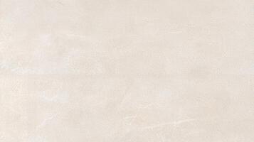 Light Beige Textured Concrete Wall Surface with subtle grain and roughness ideal for backgrounds, architectural elements, or design projects requiring a neutral stone texture. photo