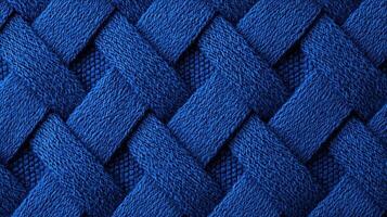Blue Braided Yarn Textile Close Up Texture showing intricate weave pattern and detailed fiber structure in bold vivid color. photo