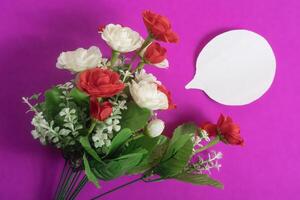 Colorful floral bouquet featuring red and white flowers on a vibrant background. photo