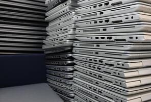E-waste - dozens of laptops in a storage room photo