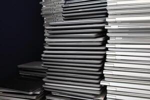 Electronic waste - pile of laptops in a storage room photo