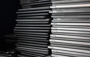 E-waste - big stacks of obsoletlaptops to be discardede photo
