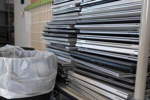 E-waste - stacked laptops to be discarded photo