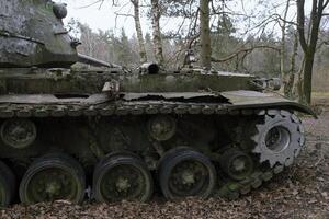 Remains of a tank from the second World War in a forest in Germany photo
