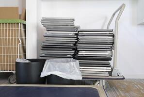 Electronic waste - stack of laptops on a trolley to be discarded photo