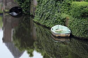 Abandoned rowboat on a canal in Amersfoort, Netherlands photo