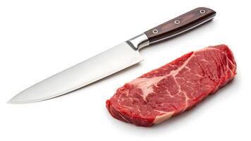 Freshly cut meat with a sharp knife on a clean surface photo