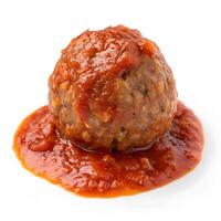 Savory meatball topped with rich tomato sauce on a white plate photo