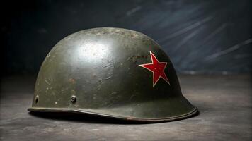 Soviet military helmet with red star emblem on grey background photo