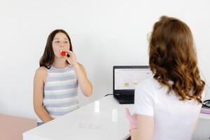 Teengirl having asthmatic attack and using inhaler preventing respiratory depression photo
