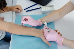 Doctor doing skin allergy test at white table in office. Allergy test, skin allergy testing for possible allergens. photo
