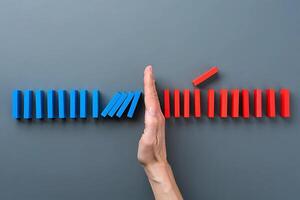 Hand Intervening Between Falling and Standing Blocks photo