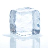 Single Clear Ice Cube Reflecting on a Bright Surface photo