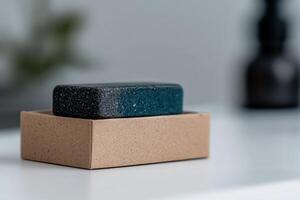 Handcrafted soap bar in a simple box on a minimalist surface photo