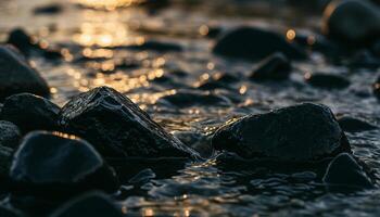 Close-up of wet rocks with sunlight shimmering on shallow water creating serene natural view photo