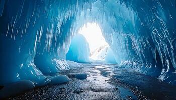 Inside an enchanting ice cave with glowing blue hues and magnificent frozen formations photo