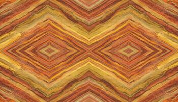 Kaleidoscope pattern of colorful rock formations with diamond shapes and layered geological textures photo