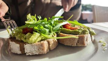Enjoying a fresh and healthy brunch in a scenic outdoor setting video