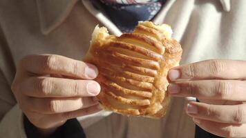 Enjoying a delicious pastry in a cozy cafe setting video