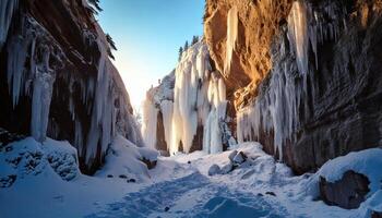 Winter canyon with towering icicles snow-covered rocks and glowing light reflections in frozen scenery photo