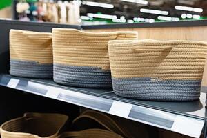 A wicker basket in the store made of ecological materials. Reuse of items. Handmade work. photo