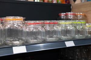 Neatly organized labeled food pantry in a home kitchen with spices grains flour rice sugar nuts photo