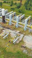 Aerial view Gas production. Large gas distribution complex. A gas worker or a station operator shuts off the gas supply. Gas production station located in the mountains. video