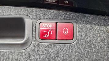 Car interior buttons for trunk operation and locking system photo