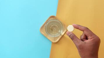 Discovering the process of dissolving a tablet in clear liquid video
