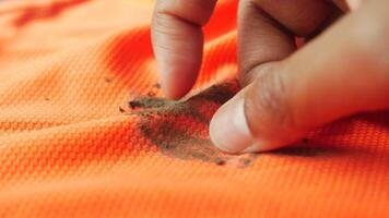 Removing dirt stains from orange fabric easily at home video