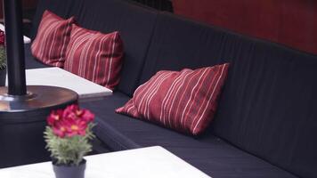 Cozy seating area with colorful cushions in a relaxed setting video