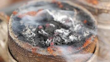 Burning incense with aromatic smoke rising in tranquil setting video