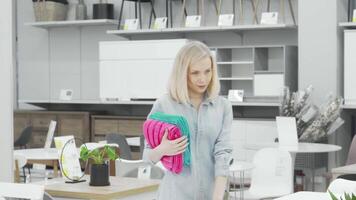 Stylish woman exploring a modern furnishings store video